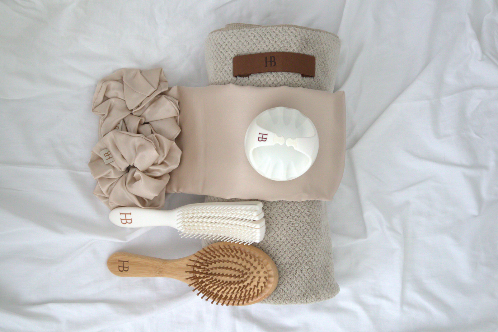 HijaBrush Chapter I manual stimulation kit with six covered-hair care tools